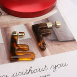 "F" Earrings
