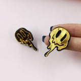 Melted happy face earring