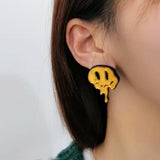 Melted happy face earring