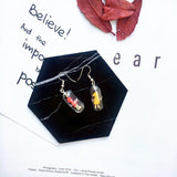 Human Capsule Earrings