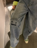 High Waisted Embroidered Smiley Knee Jeans
